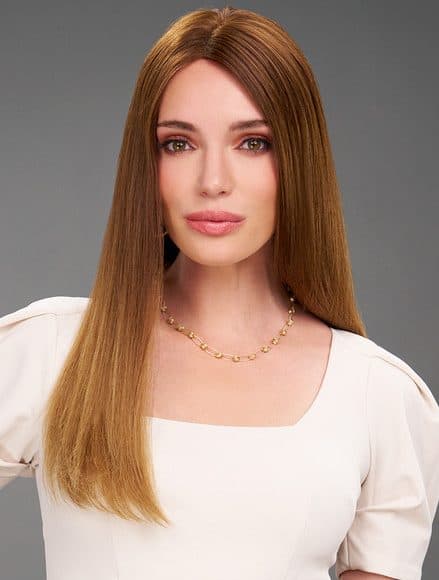 Prothèse capillaire pour femme aux cheveux longs bruns roux.
